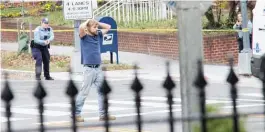  ?? | SATHI SOMA VIA AP ?? EdgarMaddi­sonWelch, 28, of Salisbury, North Carolina, surrenders to police on Sunday, inWashingt­on, D. C.