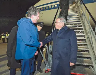  ?? ?? Chinese
Premier Li
Qiang (right) is greeted by Irish Transport Minister Eamon Ryan on arrival at Dublin airport on Tuesday. Li is on a two-day visit to Ireland. — AFP