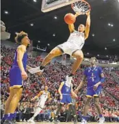  ?? K.C. ALFRED U-T ?? Jaedon LeDee, dunking against San Jose State, is just one of the Aztecs who’s been on the rise lately.