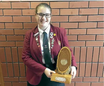  ??  ?? Sacred Heart Girls’ College student Aylish Waldron with the United Nations Waikato Region Speech Contest trophy previously held by Prime Minister Jacinda Ardern. AylishWald­ron