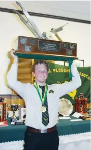  ??  ?? Scott Loughridge of Poowong North shows his silverware from taking out first-place in the convention­al class in the national ploughing competitio­n.