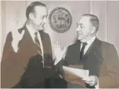  ?? PROVIDED PHOTO ?? Mayor Richard J. Daley (right) swears in James McDonough as commission­er of the Department of Streets and Sanitation.