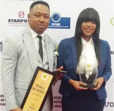  ??  ?? L-R: Head, Sales and Marketing, Jerry Opiughie, and Assistant Secretary, Head, Human Resources, Stephanie Williams receiving the Hotel of the Year Award won by Wells Carlton Hotel and Apartments at the Nigeria Entreprene­urs Award recently