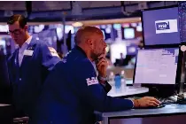  ?? IMAGES PHOTO VIA AFP GETTY ?? Traders work on the floor of the New York Stock Exchange in New York City on Wednesday, Sept. 21, 2022 (September 22 in Manila).