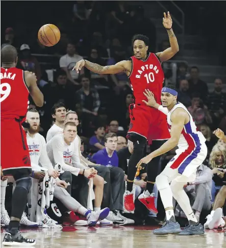  ?? GREGORY SHAMUS/GETTY IMAGES ?? Raptor DeMar DeRozan, middle, has become more of a ball-distributo­r after enduring frequent double- and tripleteam defences in Kyle Lowry’s absence.