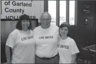  ?? The Sentinel-Record/File photo ?? UNITED WAY: Kathy Allen, left, Terry Wallace, center, and Jennifer Orr pose at the United Way Day of Caring event on Sept. 13, 2012, at Oalawn Park. Wallace, who was the announcer for the race track for 37 years, passed away Thursday.