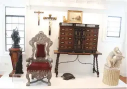  ??  ?? Religious antiquitie­s including the 17th to 18th century Spanish coin cabinet and the Bolivian Episcopali­an Chair.