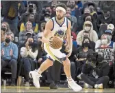  ?? JOHN HEFTI — THE ASSOCIATED PRESS ?? Golden State Warriors guard Klay Thompson (11) takes the ball down court against the Cleveland Cavaliers during the second half Sunday in San Francisco.