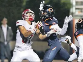  ?? Ringo H.W. Chiu For The Times ?? KYLE FORD, trying to make a catch against Chaminade two years ago, is a fivestar receiver at Orange Lutheran and one of the prized recruits signed by USC.