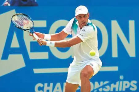  ?? Rex Features ?? Gilles Muller in action during the quarter-finals of the Aegon Championsh­ips Queen’s Club on Friday. The 34-year-old carved down 12 aces to beat former champion Sam Querrey.