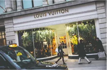  ?? JACK TAYLOR/GETTY IMAGES ?? “The luxury players that are doing well are the ones who have played the ultimate card of luxury ... customizat­ion is part of that uber luxury,” says Louis Vuitton CEO Michael Burke.