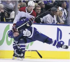  ?? VERONICA HENRI ?? Maple Leafs defenceman Rasmus Sandin is put in an uncomforta­ble position by Canadiens winger Nikita Scherbak, Monday.