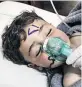  ??  ?? HORROR Child injured in the Syrian gas attack