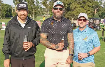  ?? ?? Enjoying some beverages in the sunshine are Matt Thompson, Kane Latham and Aaron Avery.