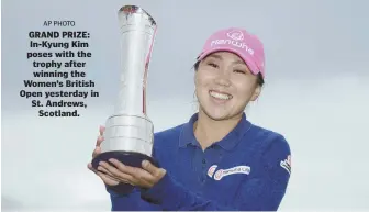  ?? AP PHoto ?? GRAND PRIZE: In-Kyung Kim poses with the trophy after winning the Women’s British Open yesterday in St. Andrews, Scotland.