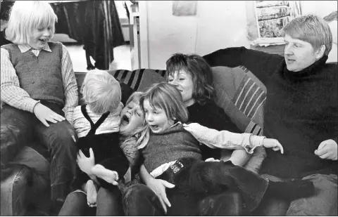  ??  ?? ENCOURAGED TO BE COMPETITIV­E: Boris, left, and father Stanley, right, watch as Jo, Rachel and Leo romp on a sofa with Charlotte in 1972