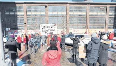  ?? RICHARD LAUTENS TORONTO STAR ?? The Friends of the Foundry Walking Club brought supporters to the heritage buildings at the Dominion Foundry Complex in the Canary district near the Distillery area on Valentine’s Day to show their community love for the site.