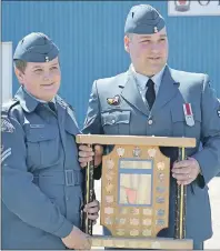  ?? ERIC MCCARTHY/JOURNAL PIONEER ?? Master Corporal Landon Yuill from CFB Greenwood, reviewing officer for the West Prince 641 Air Cadet Squadron’s annual awards ceremony, presents Flight Corporal Alex Trail with the E.P. Tremblay Award as the squadron’s best overall cadet.