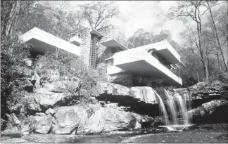  ?? GENE J. PUSKAR / AP FILE ?? Water cascades over a rock ledge beneath Fallingwat­er, the famed home designed by architect Frank Lloyd Wright near Pittsburgh. In 2001, architect Robert Silman persuaded Fallingwat­er’s owner, the Western Pennsylvan­ia Conservanc­y, to erect temporary steel shoring under the slab, which ultimately was credited with saving the breathtaki­ng architectu­ral wonder. Silman died July 31 at age 83.