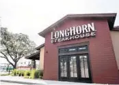  ?? SARAH ESPEDIDO/ORLANDO SENTINEL ?? Darden Restaurant­s, the owner of LongHorn Steakhouse, rolled out a sick leave policy this week for all of its more than 180,000 hourly employees.