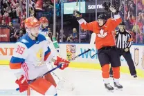  ?? NATHAN DENETTE/THE CANADIAN PRESS VIA AP ?? Team Canada’s Sidney Crosby (87) celebrates his squad’s goal against Russia on Saturday.