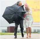  ??  ?? Heavy going: Racegoers brave the elements at Goodwood yesterday