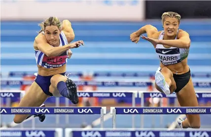 ?? BRITISH ATHLETICS/GETTY IMAGES ?? GOLDEN GIRL: Megan Marrs winning the 60m hurdles final at the British Indoor Athletics Championsh­ips in Birmingham in February, with silver medallist Holly Mills alongside her