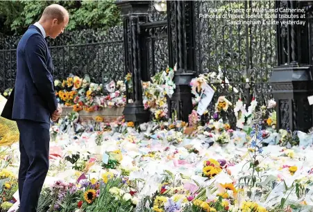  ?? ?? William, Prince of Wales and Catherine, Princess of Wales, look at floral tributes at Sandringha­m Estate yesterday