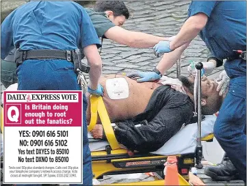  ??  ?? Khalid Masood is taken away on a stretcher after being shot dead by police guarding MPs