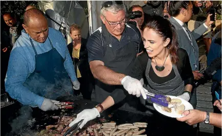  ?? PHOTO: GETTY IMAGES ?? Prime Minister Jacinda Ardern and Labour deputy leader Kelvin Davis help cook breakfast following the Waitangi Day dawn service.