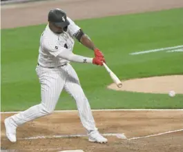  ?? MATT MARTON/AP ?? Sox left fielder Eloy Jimenez hits an infield single in the second inning Tuesday night to drive in Danny Mendick. Jimenez went 2-for-4 with an RBI.