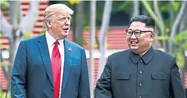  ?? DOUG MILLS/THE NEW YORK TIMES ?? U.S. President Donald Trump and Kim Jong Un, the leader of North Korea, take a walk after their lunch on Sentosa Island.
