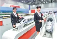  ?? XINHUA ?? Models display CRRC trains at an industry expo in Kuala Lumpur, Malaysia.