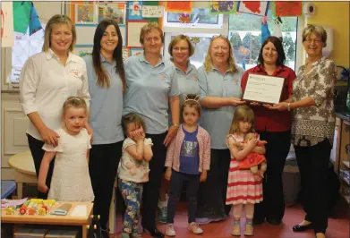  ??  ?? Proudly displaying their new accreditat­ion at Naoi Ionad na Cille were: Back (from left): Eileen Prendevill­e, Sandra Villena Rodriguez, Noreen McKenna, Pauline O’Shea, Martina O’Connor, Joanne O’Connor (Centre Manager), Imelda Madigan (Early Years...