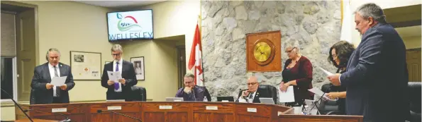  ?? [FAISAL ALI / THE OBSERVER] ?? Wellesley councillor­s read their oaths of office for the 2018-2022 municipal term during Tuesday night’s inaugural meeting.