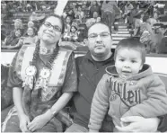  ?? JASON WARICK/The StarPhoeni­x ?? Candace Gadwa, husband Jacob Faithful and one of their children, two-year-old Jairus are active powwow participan­ts.