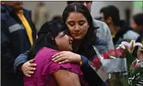  ?? JOSE CARLOS FAJARDO — STAFF PHOTOGRAPH­ER ?? Maria Hernandez, left, is consoled by friend Sintia Marquez of San Jose during a funeral for her mother Maria Marcelo at Sacred Heart of Jesus Parish in San Jose on Dec. 16. Marcelo was hit and killed by a driver on Dec. 7, marking the 61st traffic fatality on San Jose's roadways in 2022.