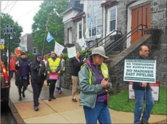  ?? BILL RETTEW JR. – DIGITAL FIRST MEDIA ?? Demonstrat­ors march down State Street in Media during the Interfaith Prayer Walk for Pipeline Safety on Saturday.