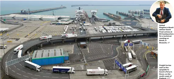  ?? AFP ?? Freight lorries wait on the quayside to board a ferry in Dover, on the south coast of England.