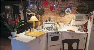  ?? P H O T O S : J O H N K E N N E Y/ MO N T R E A L G A Z E T T E ?? A view of the kitchen at the Plateau home of Diane Hébert, a jazz vocalist working part- time in a local pastry shop and raising two children.