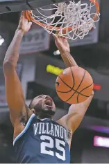  ?? JESSICA HILL THE ASSOCIATED PRESS ?? Villanova’s Mikal Bridges dunks the ball during Saturday’s game against Connecticu­t in Hartford, Conn. Villanova won 81-61.