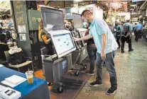  ?? MATT ROURKE/AP 2019 ?? Steve Marcinkus of the Office of the City Commission­ers shows the ExpressVot­e XL voting machine in Philadelph­ia.