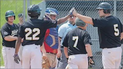  ?? JASON MALLOY/THE GUARDIAN ?? Shawn MacDougall, right, is congratula­ted at home plate after hitting a grand slam Sunday as The Alley Stratford Athletics defeated the Cardigan Clippers at MacNeill Field in Stratford.