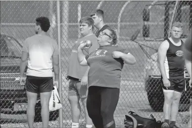  ?? Barbara hall ?? A Gordon Central shot putter sends the ball skyward during the Warriors’ recent meet at Ratner Stadium.