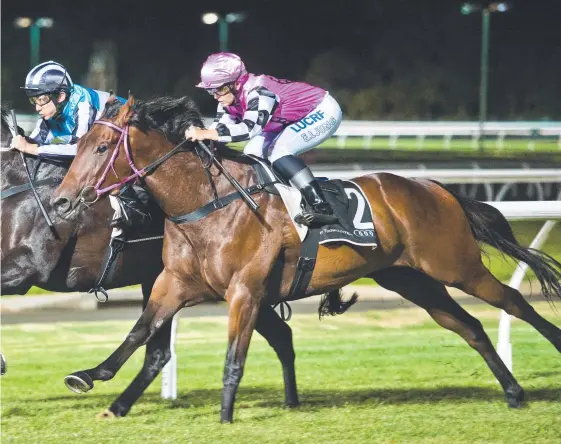  ?? Picture: NRM ?? Tisani Magic (right), with Emma Ljung in the saddle, scores one of his five wins this preparatio­n at Toowoomba.