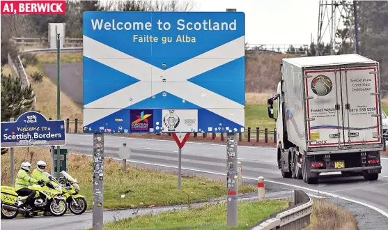  ??  ?? ‘Legitimate reason’: Motorbike police officers monitor traffic activity crossing the Border at the A1 at Berwick yesterday