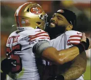  ?? NHAT V. MEYER — BAY AREA NEWS GROUP, FILE ?? The 49ers’ George Kittle (85) and Trent Williams celebrate their 24-16 win against the Los Angeles Rams at Levi’s Stadium in Santa Clara on Oct. 18.