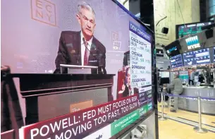  ?? AP ?? The speech of Federal Reserve chairman Jerome Powell to the Economic Club of New York appears on a television screen on the floor of the New York Stock Exchange on Wednesday.