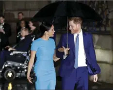  ?? AP PHOTO/KIRSTY WIGGLESWOR­TH ?? Britain’s Prince Harry and Meghan arrive at the annual Endeavour Fund Awards in London March 5, 2020. The Duke and Duchess of Sussex are expecting their second child, their office confirmed Sunday.