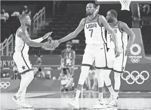  ?? GREGORY SHAMUS/ GETTY IMAGES ?? Kevin Durant ( 7) is one of six Americans who scored at least 10 points in Team USA’s group play victory against Iran on Wednesday.